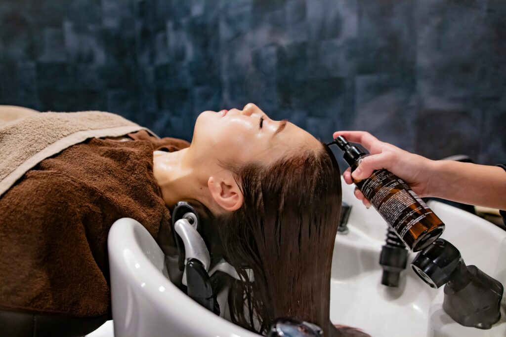 Professional head spa treatment focused on scalp care and follicle support for women experiencing thinning hair